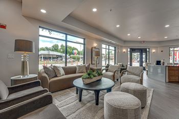 Clubhouse lounge with modern seating and large windows